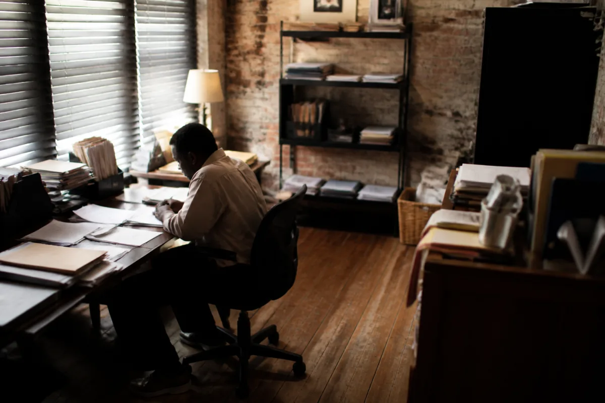 A lawyer drafting a formal request to the prefecture regarding a residency permit