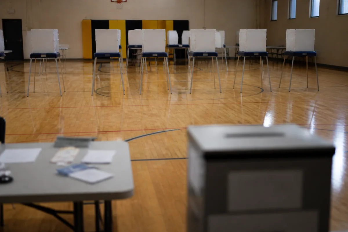 A polling place with a ballot box, symbolizing an irreversible immigration risk