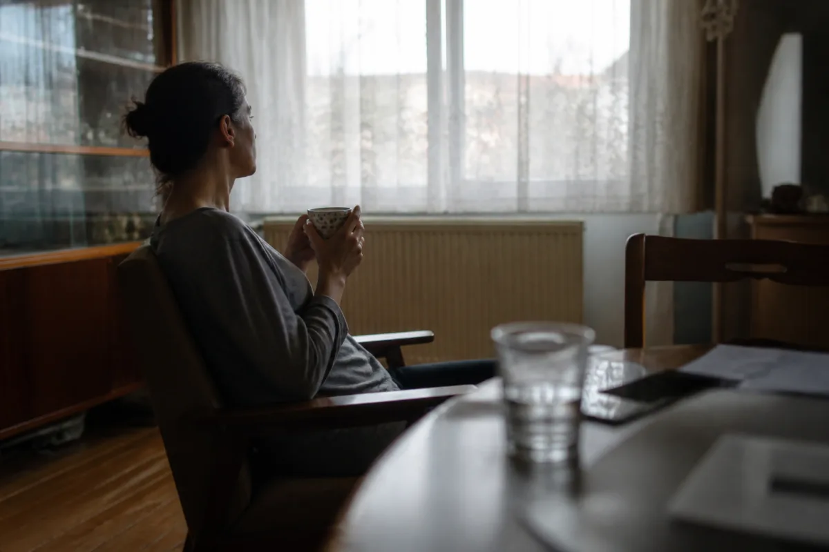 Participant of the Czech reality show "Wife Swap" in an unfamiliar household, cut off from her family back home