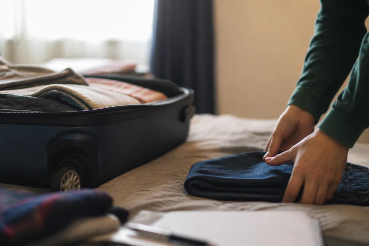 A couple with suitcases and wedding rings — representing an onshore partner visa application