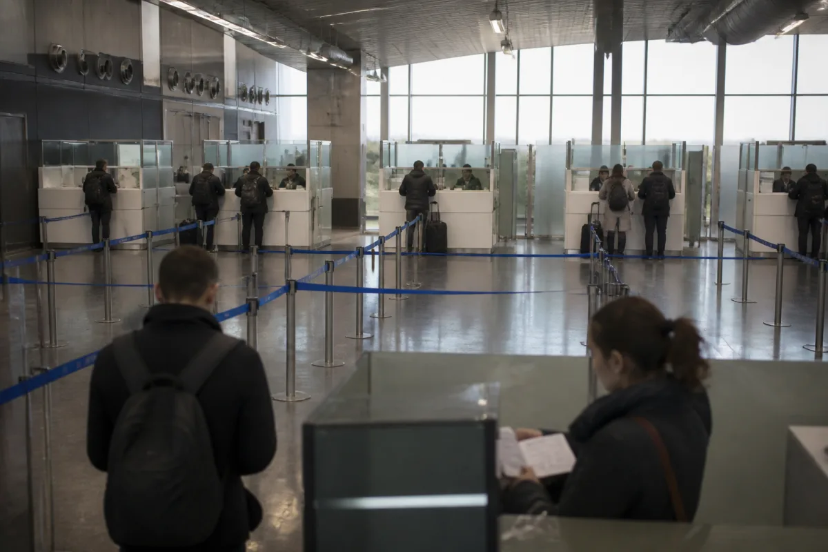 A scene depicting a permanent resident's detention on entry to the US after an I-751 petition denial